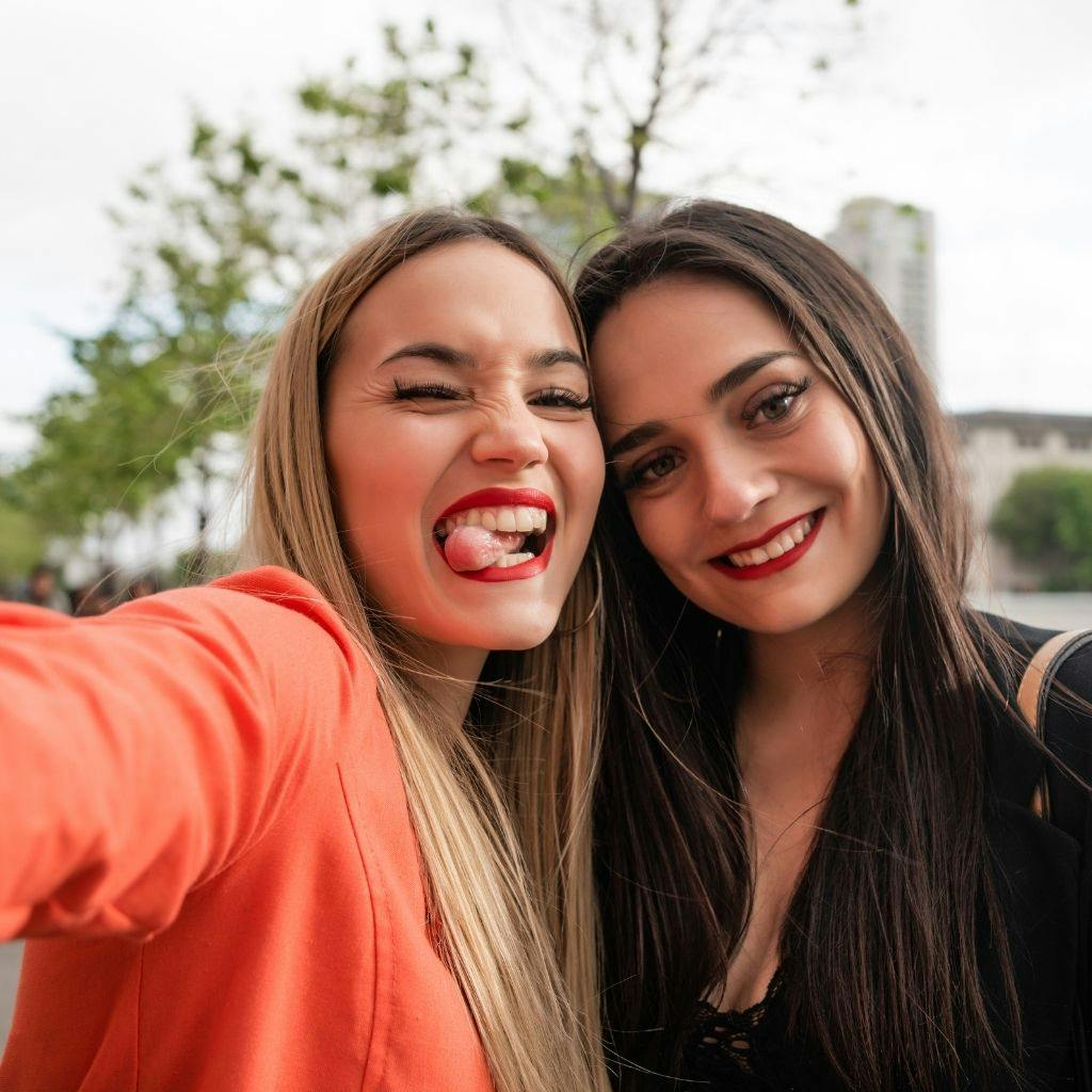 Two best friends spending time together before their dental appointments at Stonebrook Dental